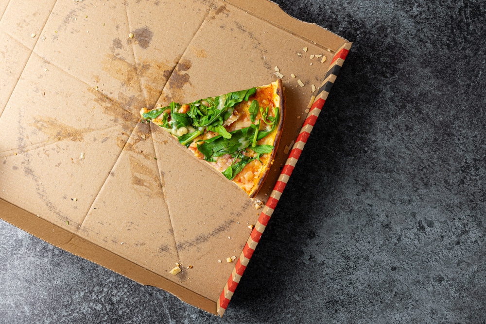 Aboveviewoflastsliceofpizzaincardboardbox - Rick's Blog