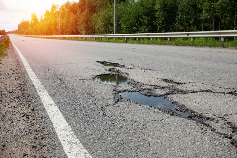 Potholesonbadasphaltroadcloseupnobody - Rick's Blog