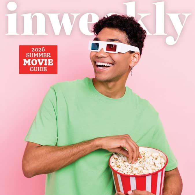 Smiling man in a mint green shirt wearing 3D glasses holds a bucket of popcorn against a pink backdrop with a red 'Summer Movie Guide' badge.