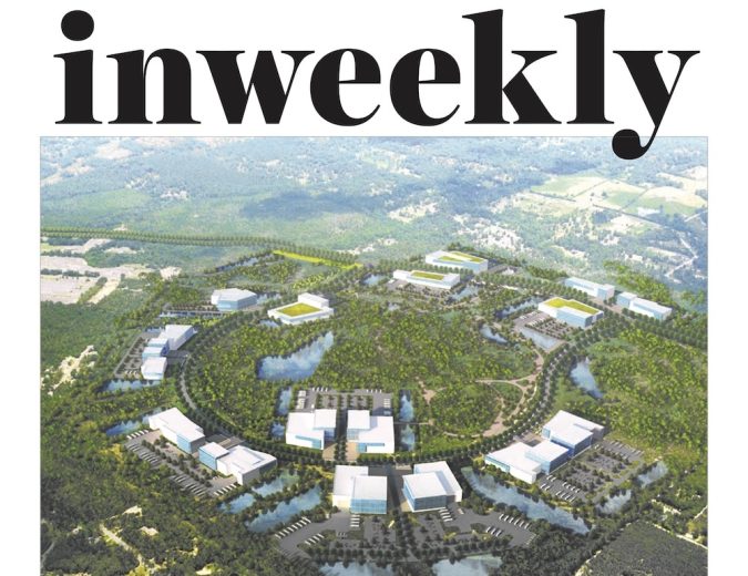 Inweekly magazine cover with an aerial view of a circular, campus-like development set in greenery and water; headline reads 'The Bluffs Could Trigger Job Boom'.