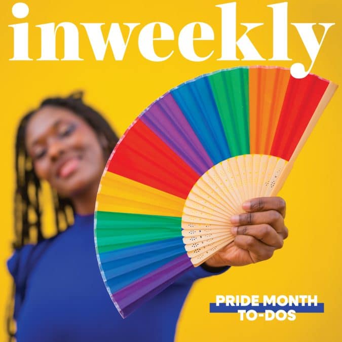 Inweekly magazine cover: smiling person in a blue shirt holds a rainbow fan against a bright yellow background; text reads 'PRIDE MONTH TO-DOS'.